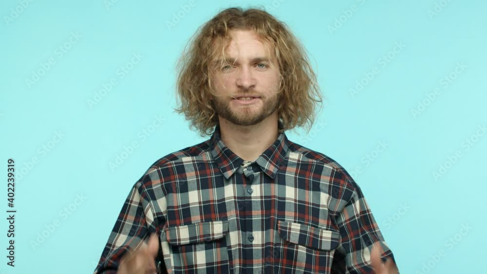Angry or annoyed blond bearded man losing patience, showing head exlosion gesture, mind blowing information, making boom sound, standing over turquoise background Angry or annoyed blond bearded man losing patience, showing head exlosion gesture, mind blowing information, making boom sound, standing over turquoise background