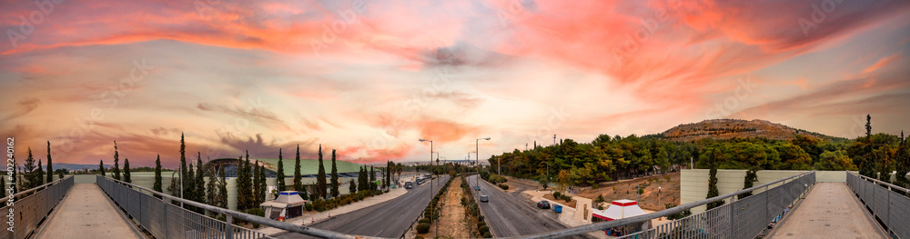 Panoramic view of the Veikou Av and the Veikou pedestrian bridge in Galatsi, Athens, Greece.