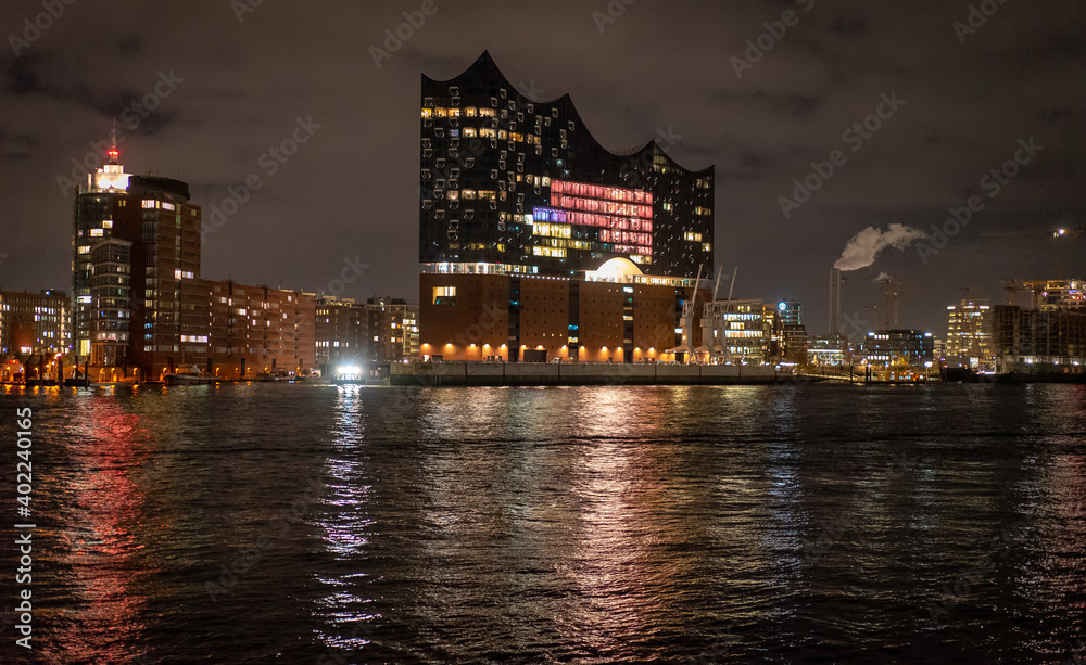 Beautiful harbour of Hamburg with Elbphilharmonie concert hall by night - travel photography