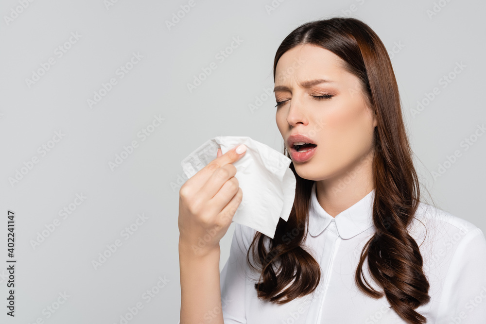 young businesswoman sneezing isolated on grey background, stock image young businesswoman sneezing isolated on grey background, stock image