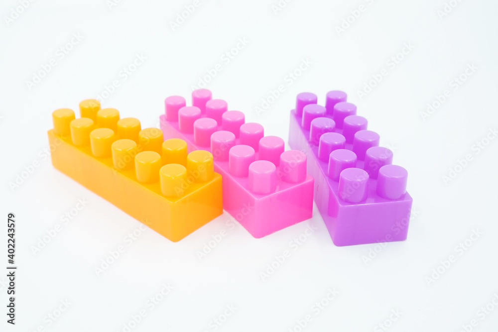 Fototapeta premium colored stacking blocks on a white background