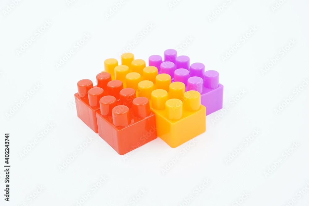 Obraz premium colored stacking blocks on a white background