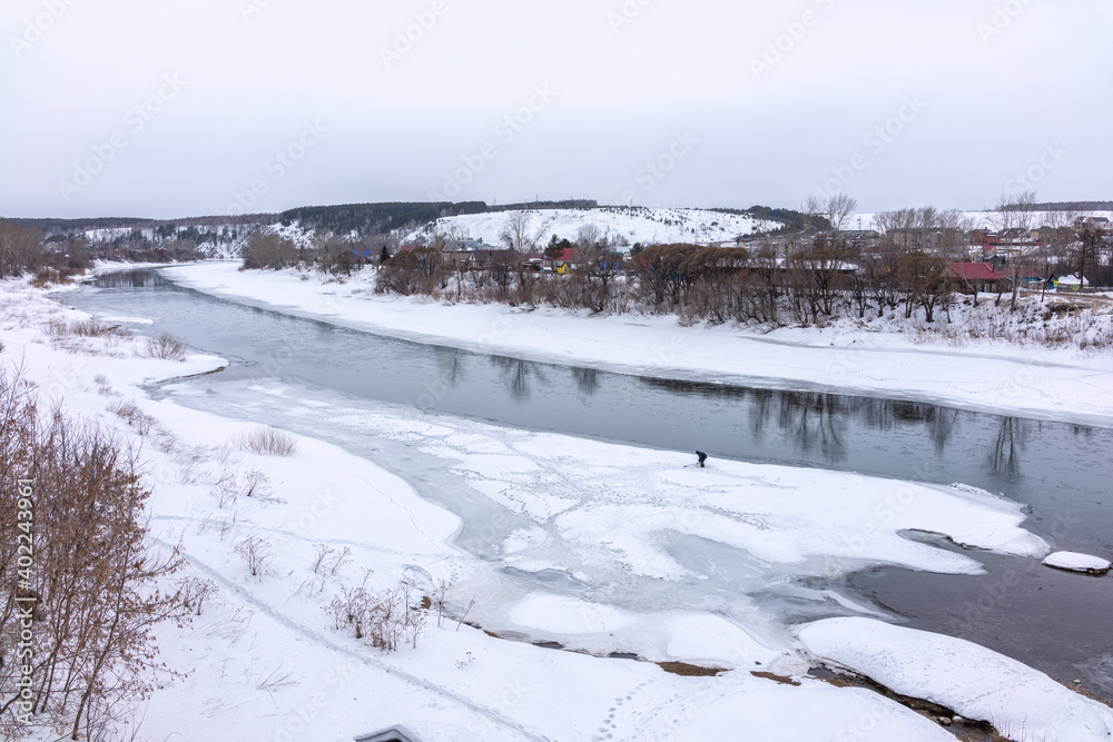 The spring river in the village began to thaw from the ice.The ice in the river began to melt. The spring river in the village began to thaw from the ice.The ice in the river began to melt.