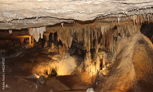 Stalactites hold tight to the ceiling, and Stalagmites grow to the ceiling from the floor. Fantastic Cavern, Springfield, Missouri.  photo
