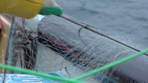 Fisherman On Boat With Net In Hands near Valparaiso, Chile. Close Up. photo