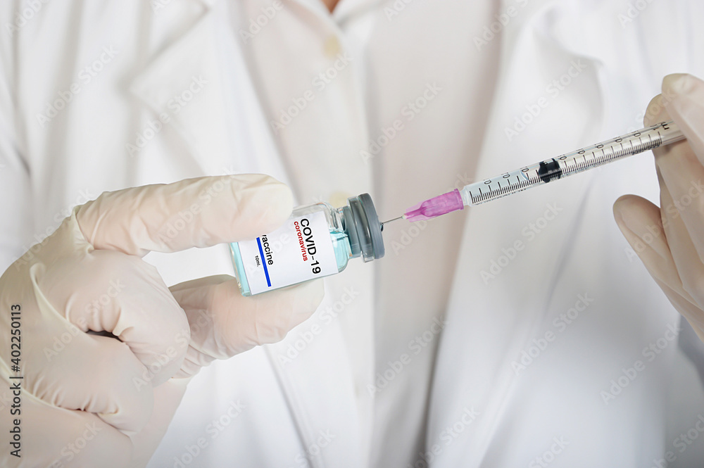 Doctor prepares vaccine Coronavirus testing injection. Doctor prepares vaccine Coronavirus testing injection.