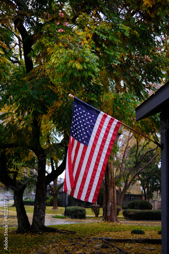 American flag in the wind against fall colors