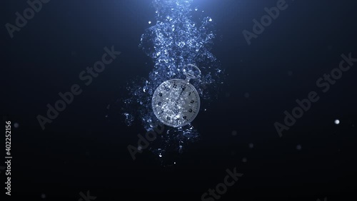Pocket watch Splash Underwater Background 4K Loop features a pocket watch splashing underwater and then floating back to the surface out of view in a loop photo