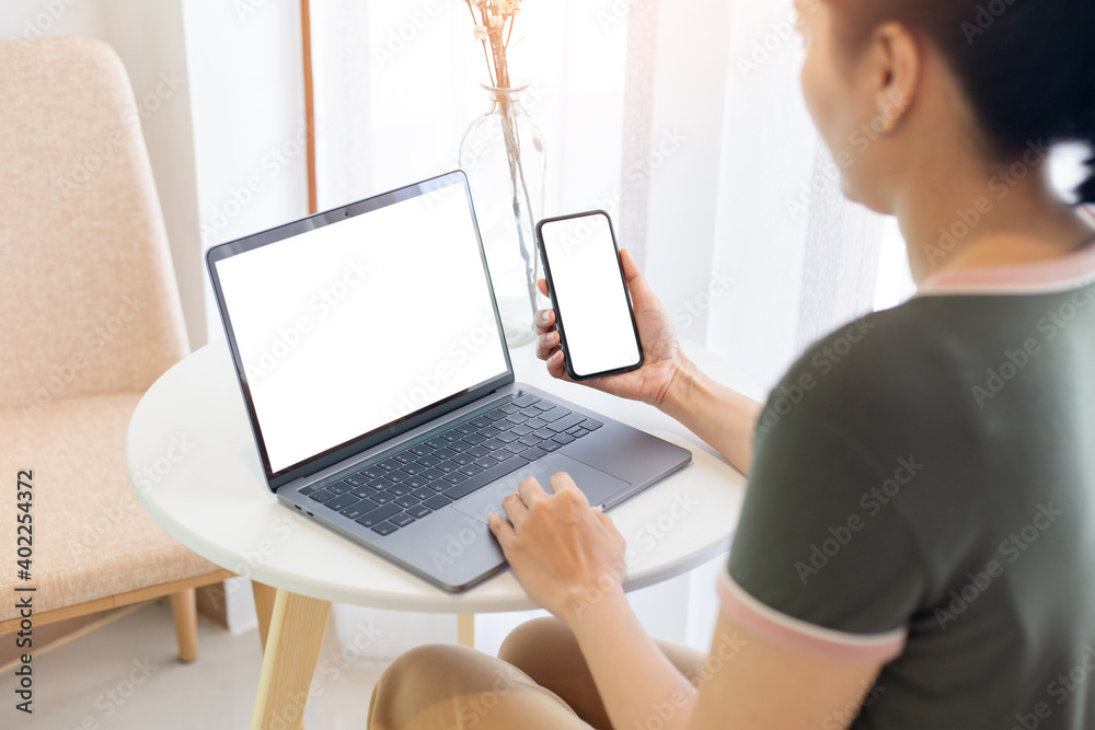 computer screen,cell phone blank mockup.hand woman work using laptop texting mobile. with white background for advertising,contact business search information on desk in cafe.marketing,design