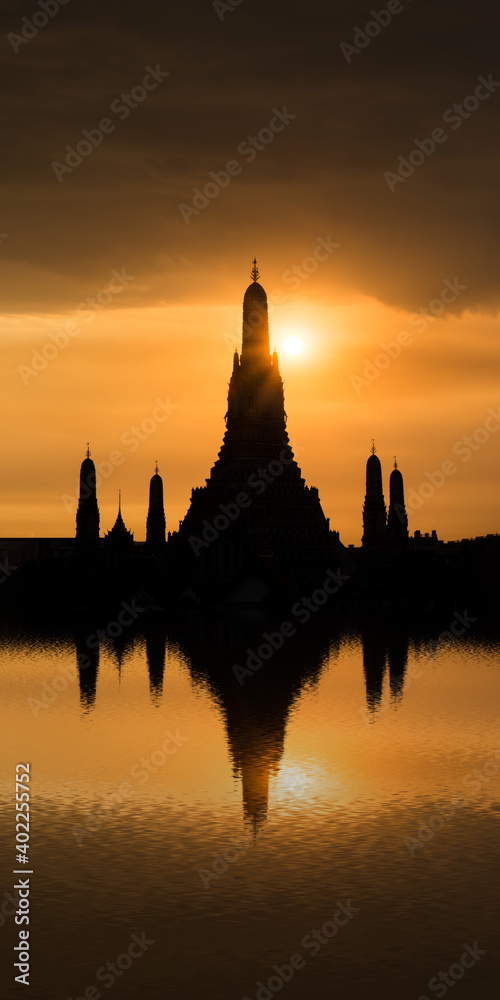 Silhouette of Wat Arun Temple in Bangkok Thailand at sunset.