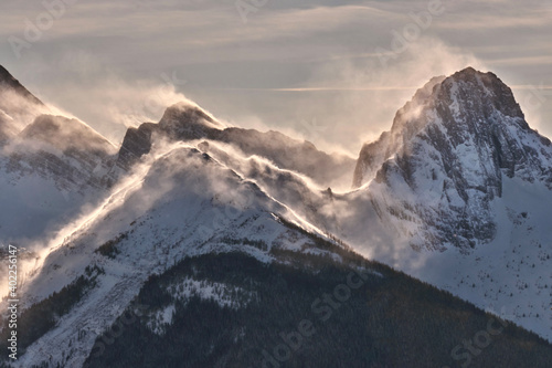 Strong wind in mountains. Glowing snow on mountain peaks. Canadian Rockies. Kooteney. British Columbia.  Canada  © aquamarine4