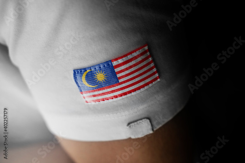 Patch of the national flag of the Malaysia on a white t-shirt