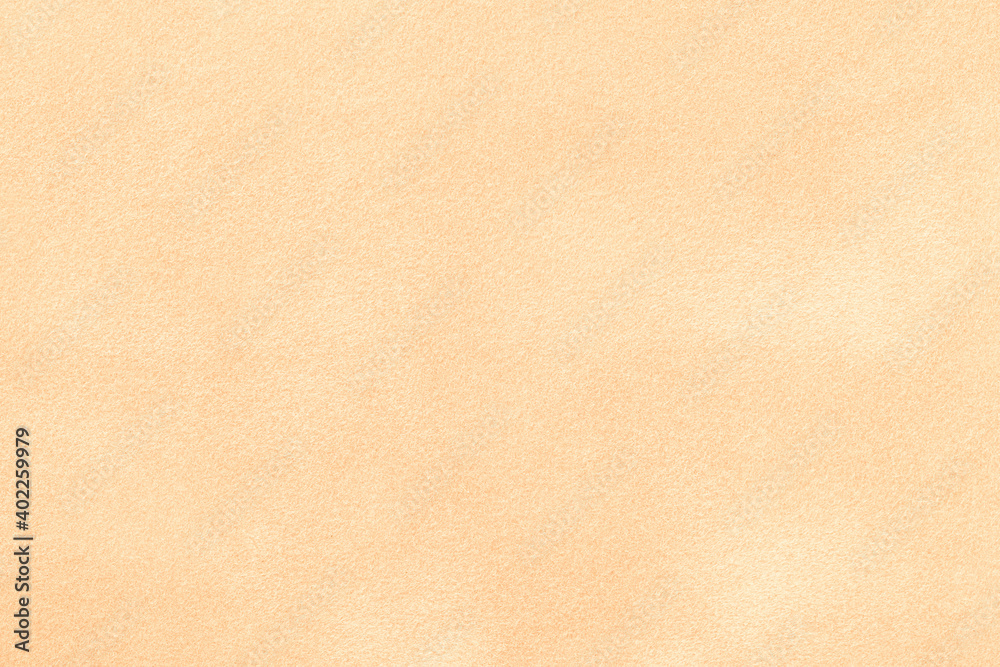 Light beige matte background of suede fabric, closeup. Velvet texture of textile Light beige matte background of suede fabric, closeup. Velvet texture of textile