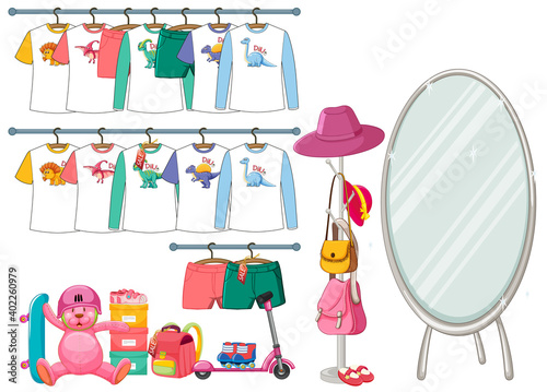 Children clothes hanging on clothes rack with accessories on white background