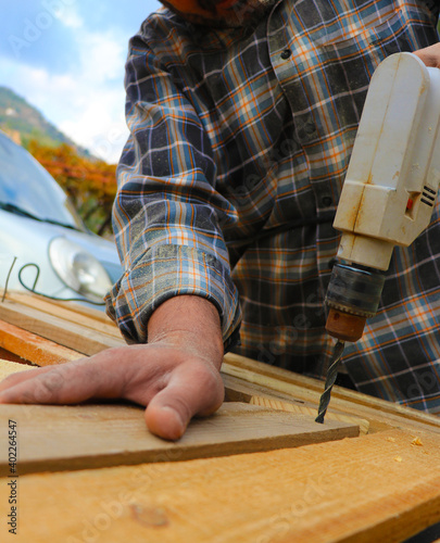 carpenter working on a wooden board