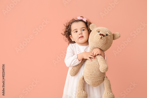 Cute baby girl with teddy b...