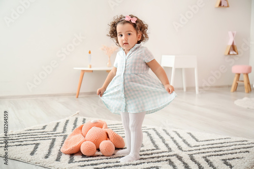Cute baby girl in stylish d...