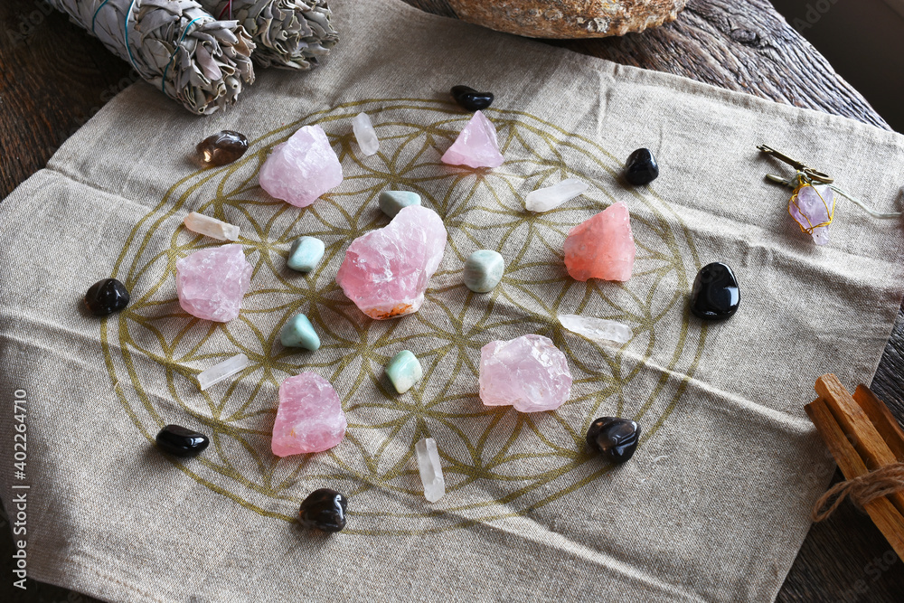 A close up image of a self love and self healing crystal grid using sacred geometry and rose quartz crystals.  - obrazy, fototapety, plakaty 