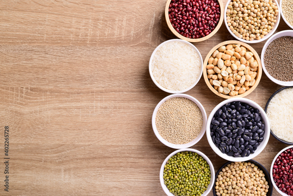 Various cereal grain in a bowl on wooden background (quinoa seeds, black kidney bean, peanut, perilla seeds, soybean, azuki beans, rice grain and mung beans) Various cereal grain in a bowl on wooden background (quinoa seeds, black kidney bean, peanut, perilla seeds, soybean, azuki beans, rice grain and mung beans)