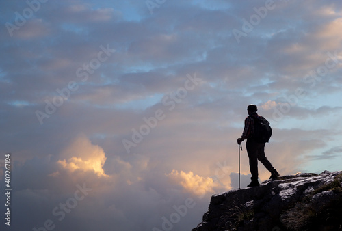 hiker on the top of a mountain in matese park in the clouds