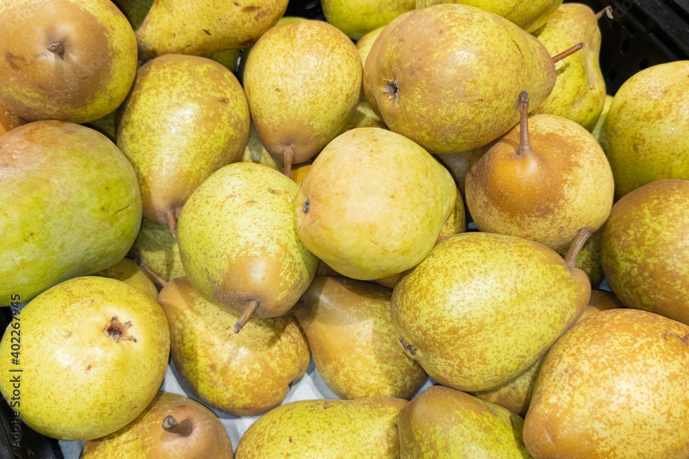 fruit fresh pears yellow on background in market for sale natural wallpaper