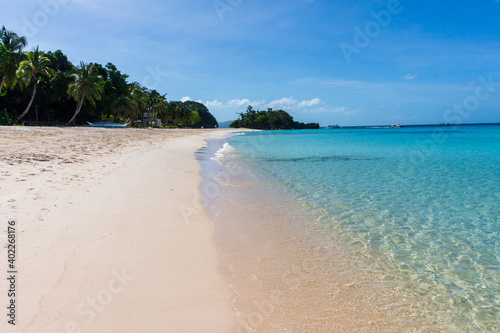 Beautiful beach on a sunny day in Boracay Island in the Philippines. Travel and holiday.