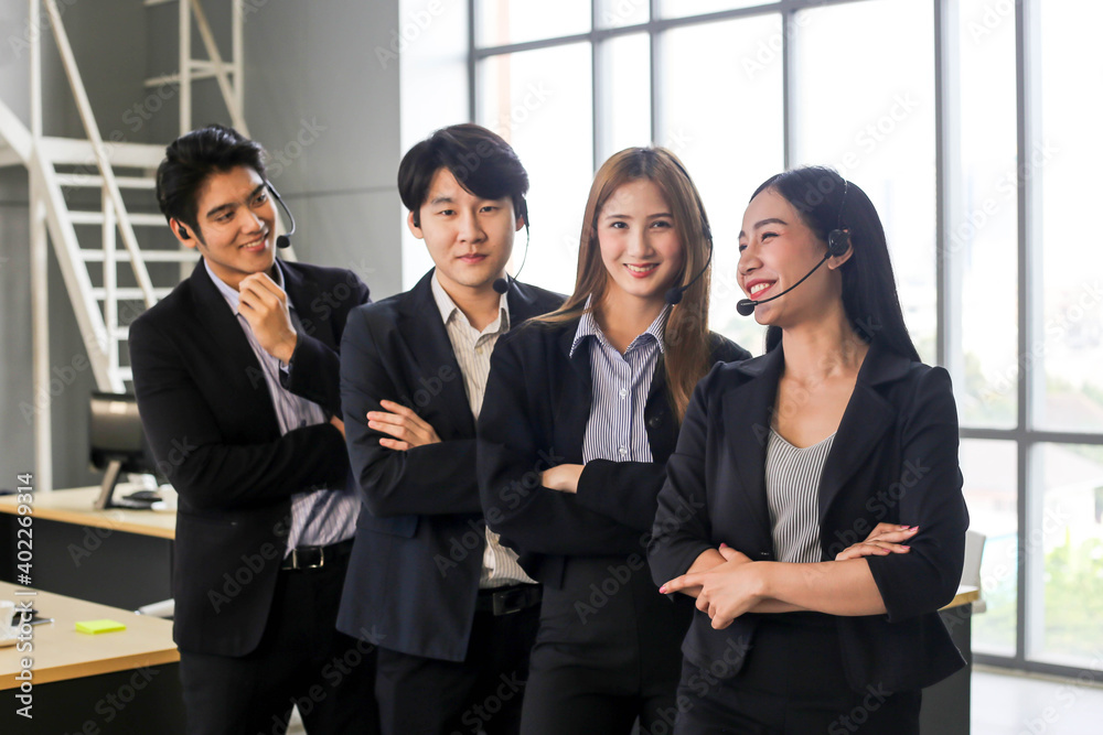 Asia Group of call center workers or Confident business team with headset in office. Asia Group of call center workers or Confident business team with headset in office.