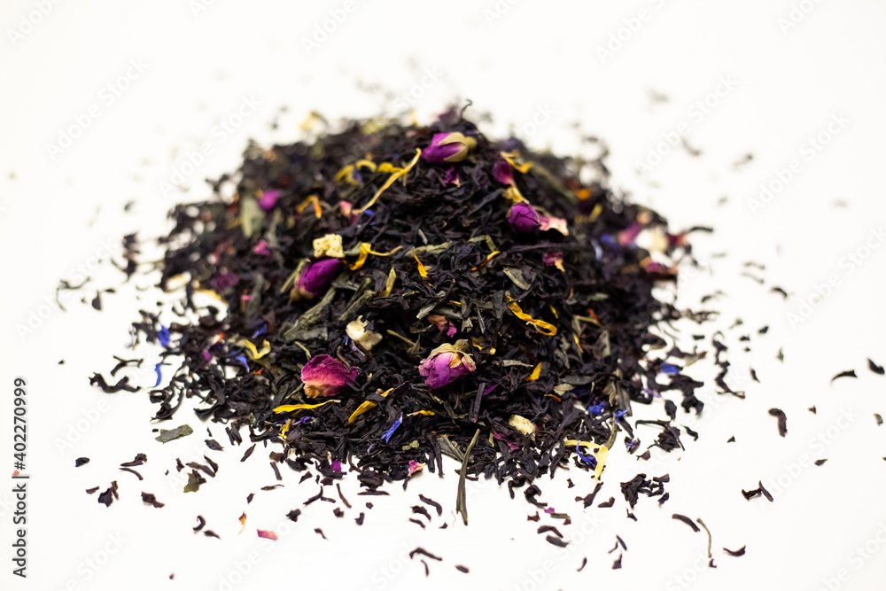 Black tea with rose petals. On a white background. Black tea with rose petals. On a white background.