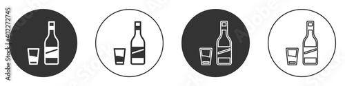 Black Bottle of vodka with glass icon isolated on white background. Circle button. Vector.
