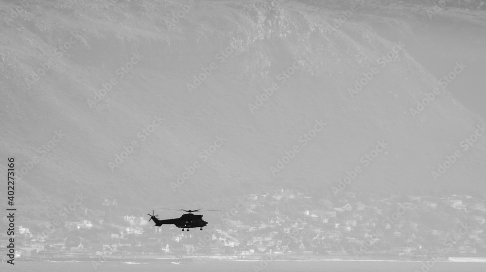 Fototapeta premium Helicopter at sea during Navy training exercises