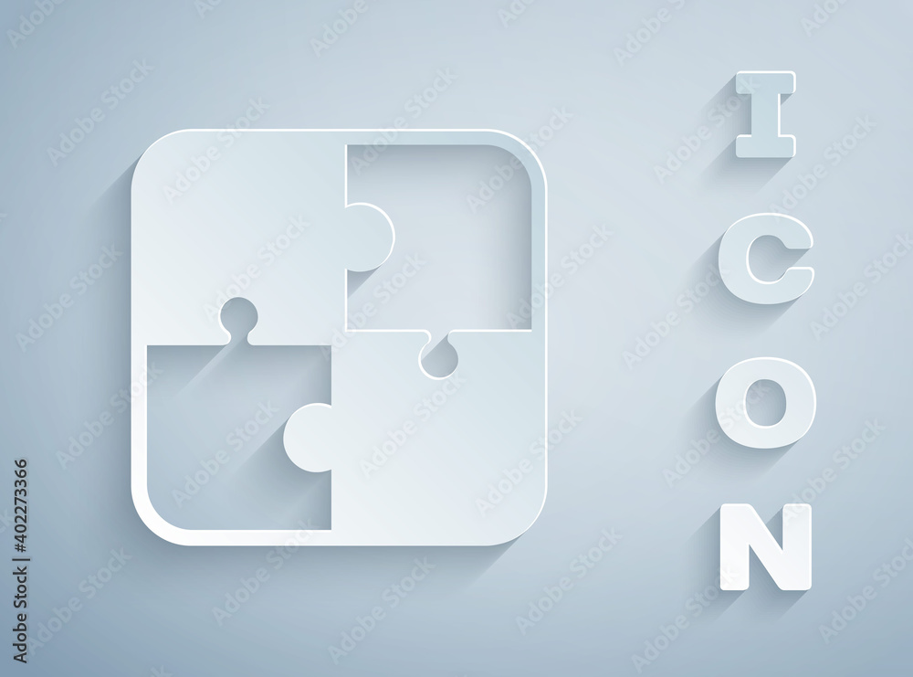 Paper cut Puzzle pieces toy icon isolated on grey background. Paper art style. Vector.