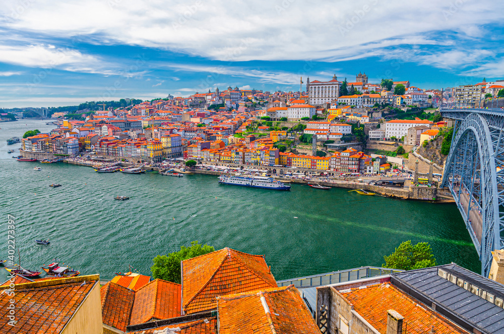Aerial panoramic view of Porto Oporto city historical centre with Ribeira district colorful buildings houses on embankment of Douro River and Ponte Dom Luis I Bridge, Norte or Northern Portugal