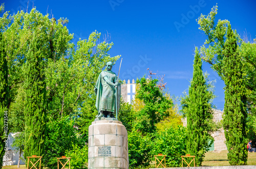 Dom Afonso Henriques Estatua statue, monument of Portugal first king with Castle of Guimaraes background, Norte or Northern Portugal photo