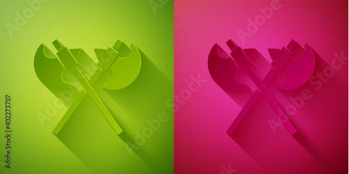 Paper cut Crossed medieval axes icon isolated on green and pink background. Battle axe, executioner axe. Medieval weapon. Paper art style. Vector.