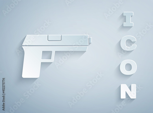 Paper cut Pistol or gun icon isolated on grey background. Police or military handgun. Small firearm. Paper art style. Vector.