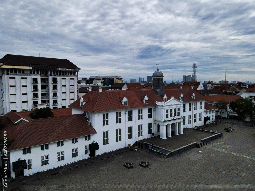 Aerial View. Fatahilah museum at Old City at Jakarta, Indonesia. With Jakarta cityscape and noise cloud when sunset. 