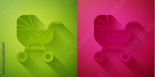 Paper cut Baby stroller icon isolated on green and pink background. Baby carriage, buggy, pram, stroller, wheel. Paper art style. Vector.