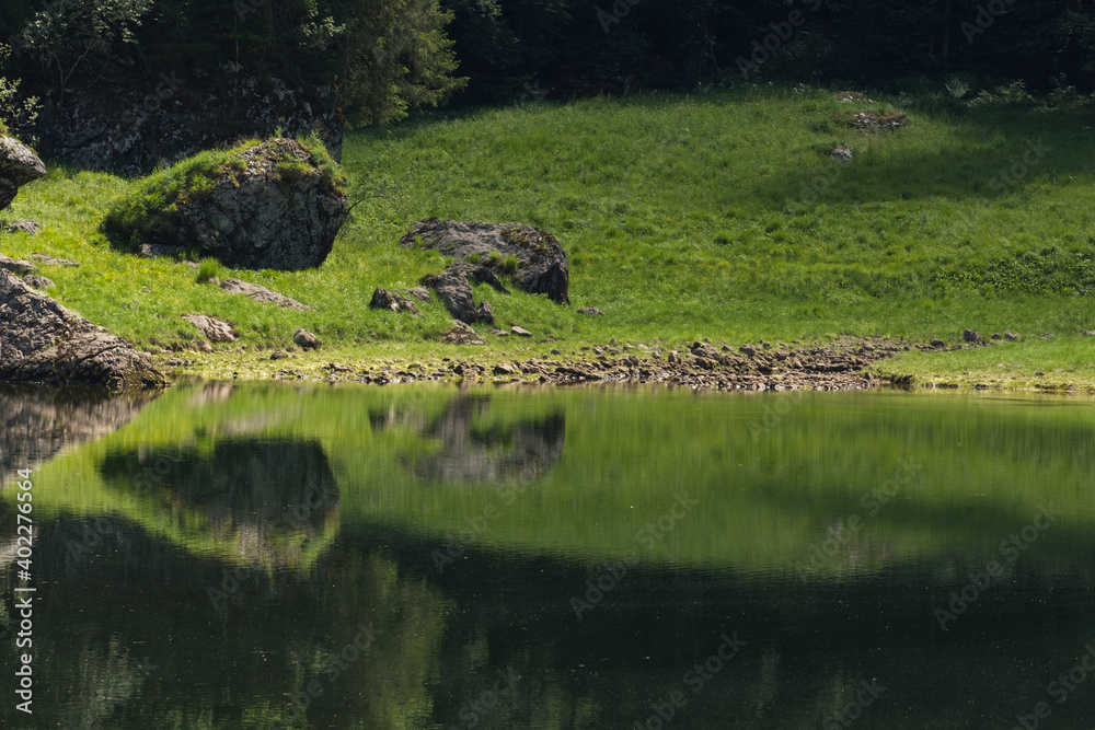 wonderful calm water with reflection in a mountain lake wonderful calm water with reflection in a mountain lake