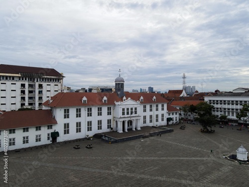 Aerial View. Fatahilah museum at Old City at Jakarta, Indonesia. With Jakarta cityscape and noise cloud when sunset