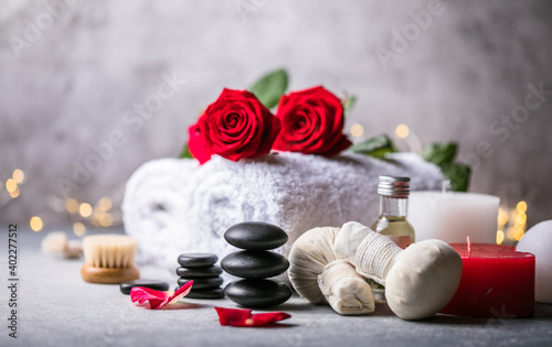 Wellness decoration, spa massage setting, oil on stone background. Valentine's Day Zen and relax concept.