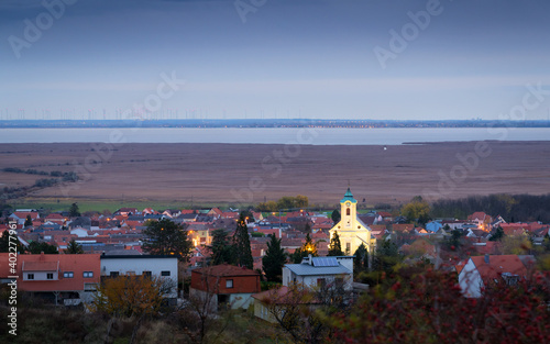 Oggau on lake Neusiedlersee with church early in the morning