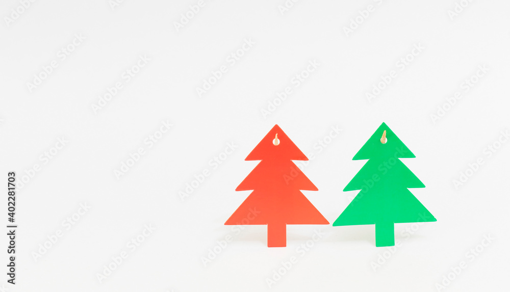 Christmas decoration with two pine trees on white background