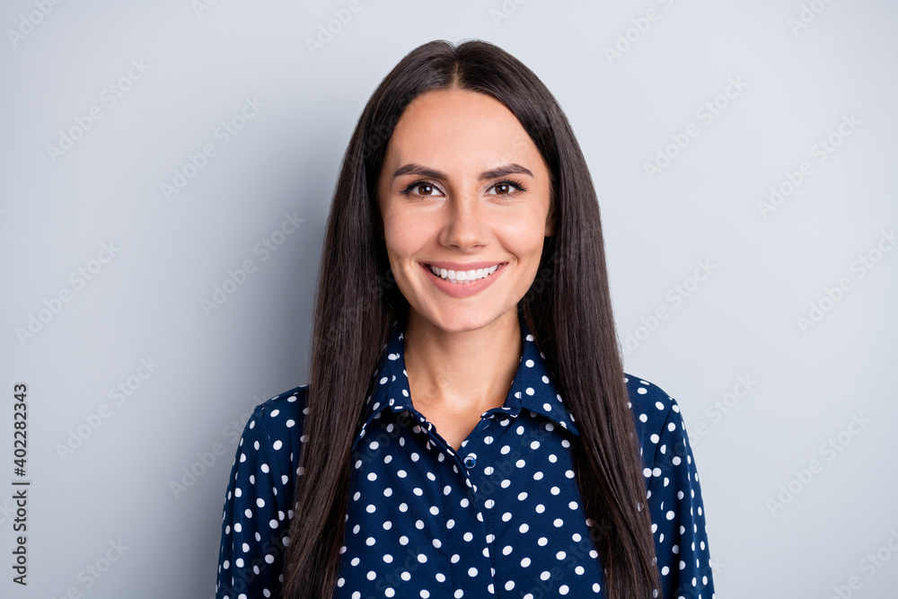 Portrait of attractive cheerful content long-haired lady wearing pin-up blouse isolated over grey pastel color background Portrait of attractive cheerful content long-haired lady wearing pin-up blouse isolated over grey pastel color background