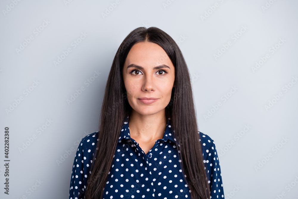 Portrait of young pretty charming beautiful serious businesswoman wear dotted blouse isolated on grey color background Portrait of young pretty charming beautiful serious businesswoman wear dotted blouse isolated on grey color background