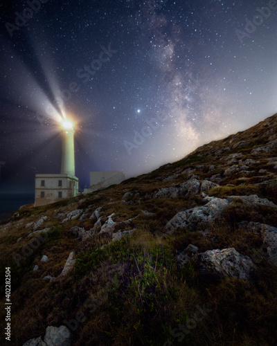 milkyway and lighthouse near the coast 