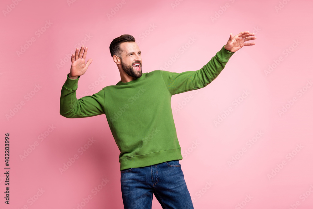 Portrait of attractive cheerful mature carefree guy having fun dancing enjoying life isolated over pink pastel color background - obrazy, fototapety, plakaty 