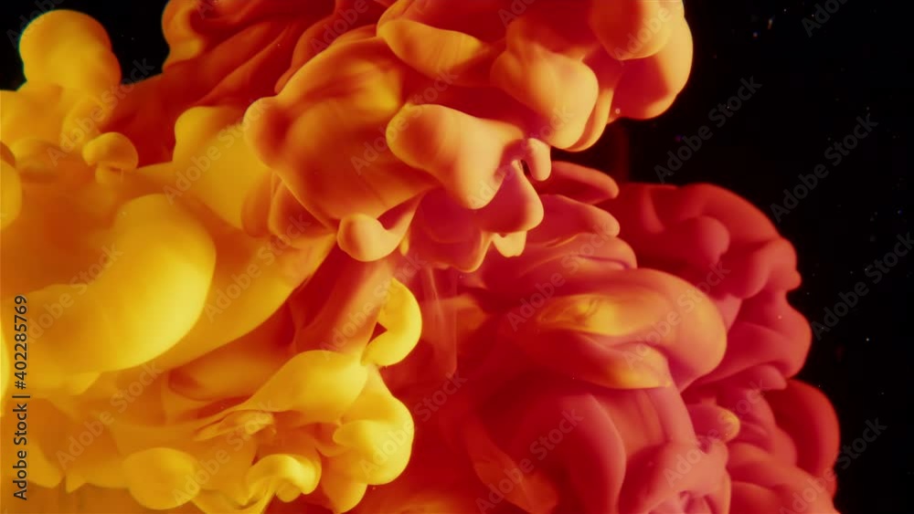Warms colours, Red and Yellow paint ink drops in water. smoke cloud Abstract art Warms colours, Red and Yellow paint ink drops in water. smoke cloud Abstract art
