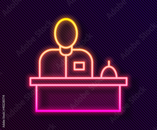 Glowing neon line Receptionist standing at hotel reception desk icon isolated on black background. Vector.