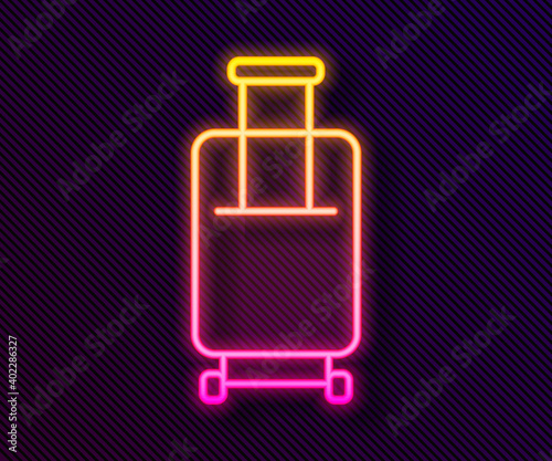 Glowing neon line Suitcase for travel icon isolated on black background. Traveling baggage sign. Travel luggage icon. Vector.