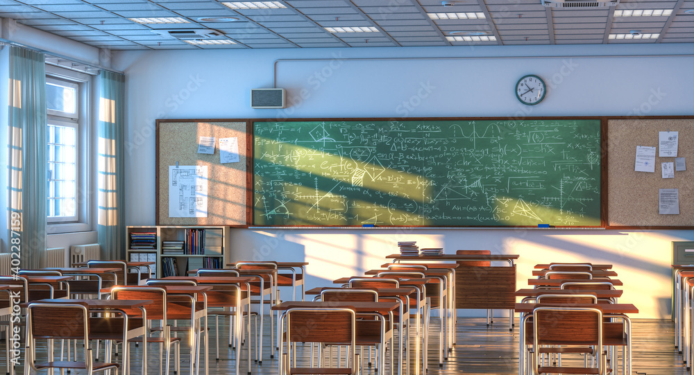 Fototapeta interior of a school classroom with wooden desks and chairs.